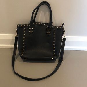 Black gold-studded handbag